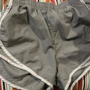 These are varsity athletic shorts. They are a size xs. They are grey and white.
